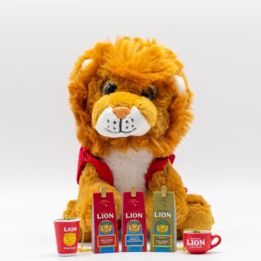 Lion stuffed animal with mini keychains in front